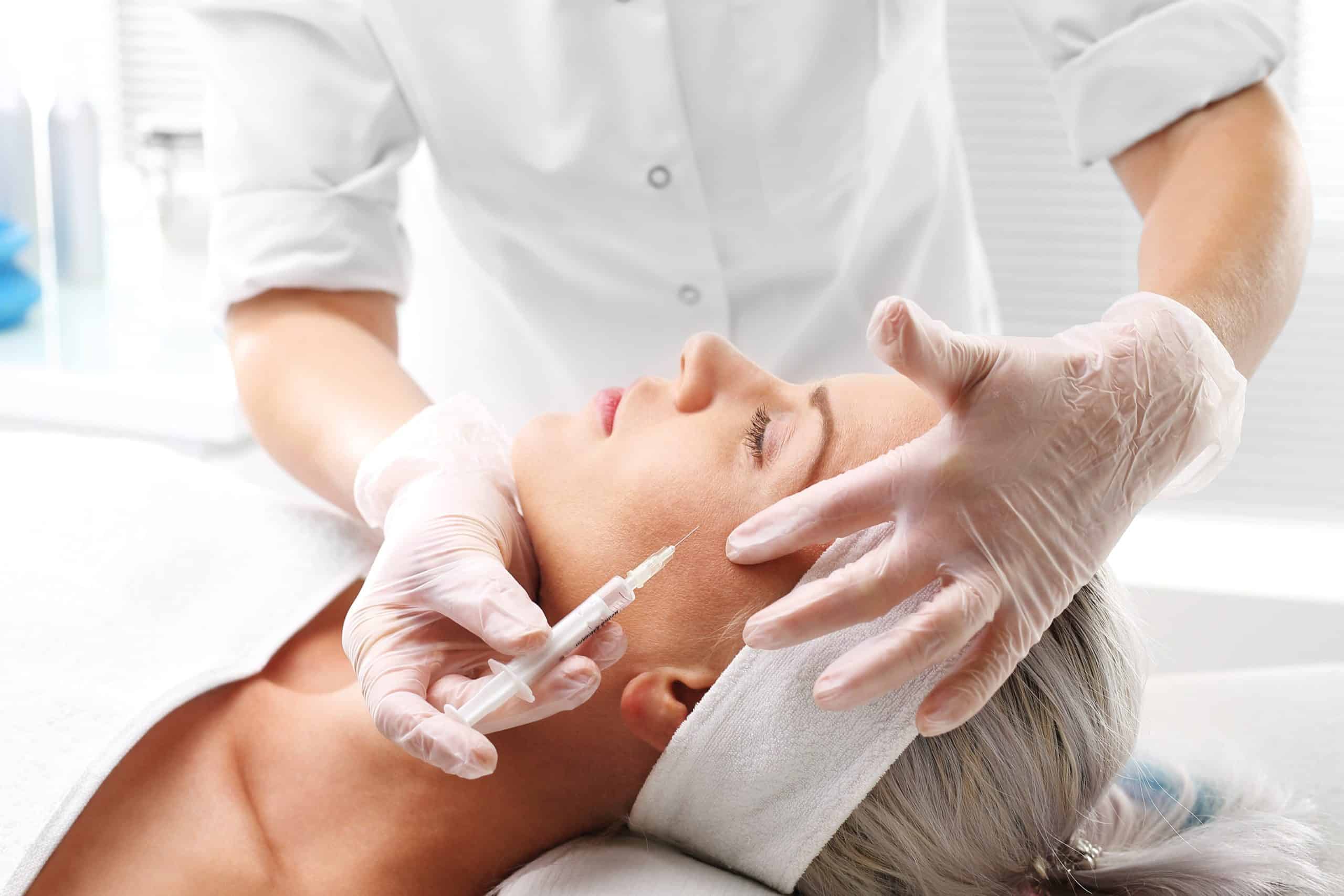 A women taking Botox Dysport Injections | Exhibit Medical Aesthetics in Denville NJ