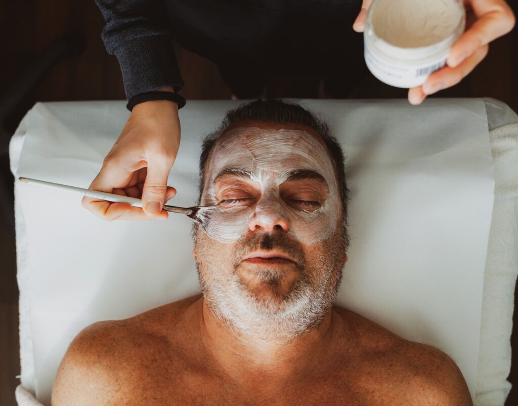 Overhead image of a man at Exhibit Medical Aesthetics receiving one of the many services at our men's wellness clinic in Denville.