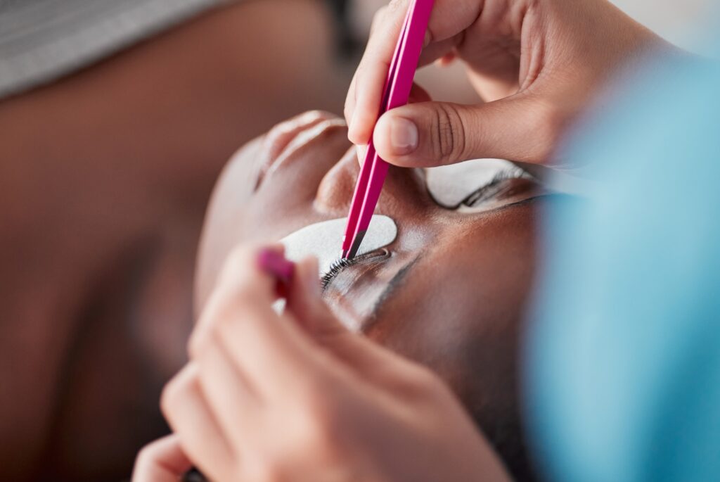 Beauty, eyelash extensions and salon with black woman for self care, makeup and cosmetology. Relax.