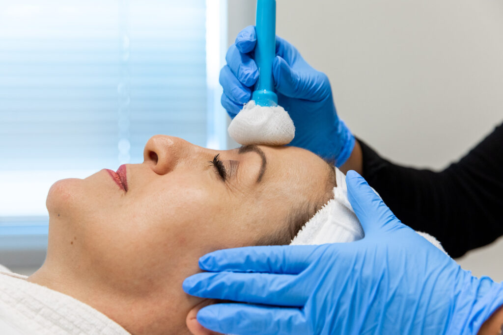 Close up of woman getting a chemical peel on her face