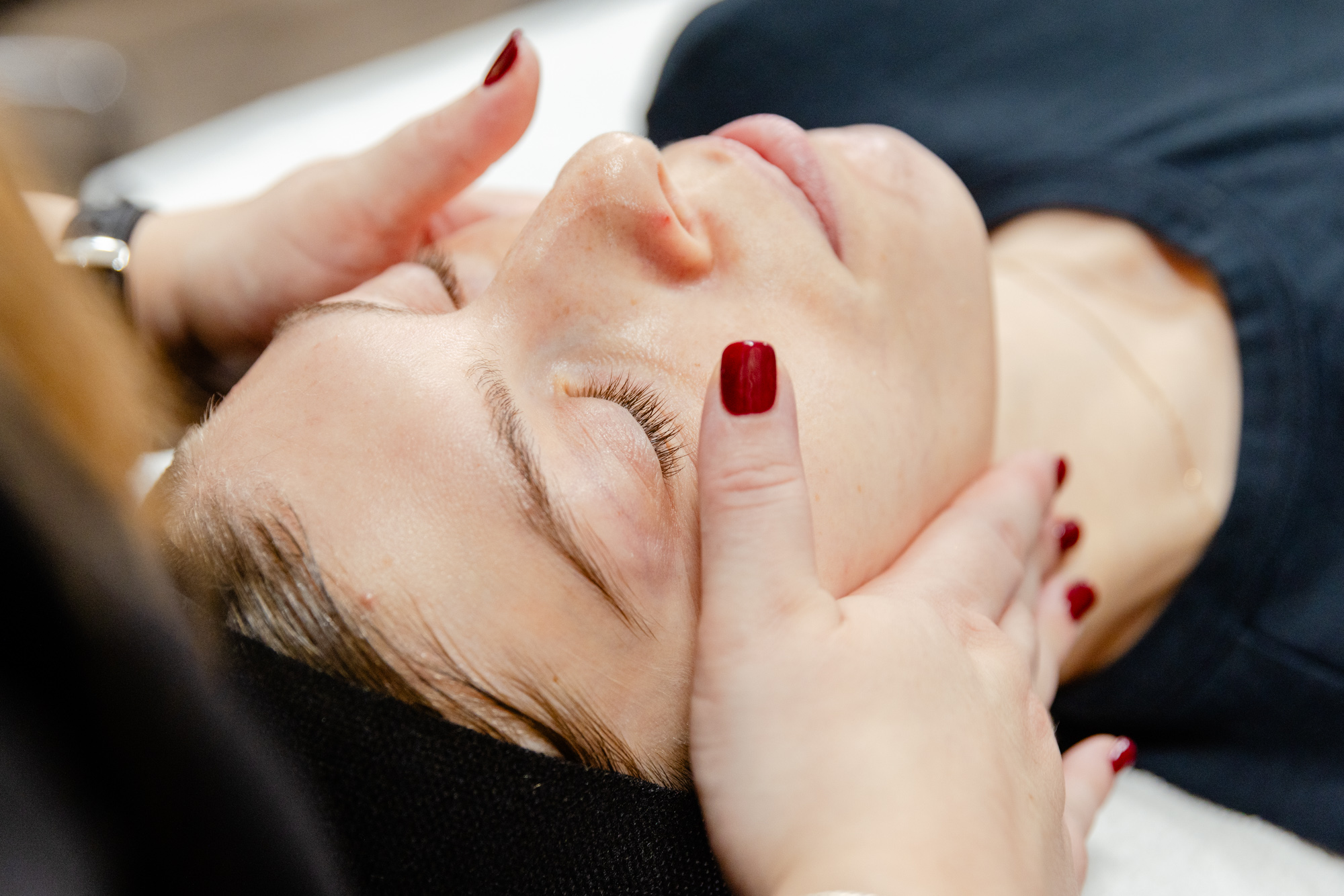 Nurse holds patient's face