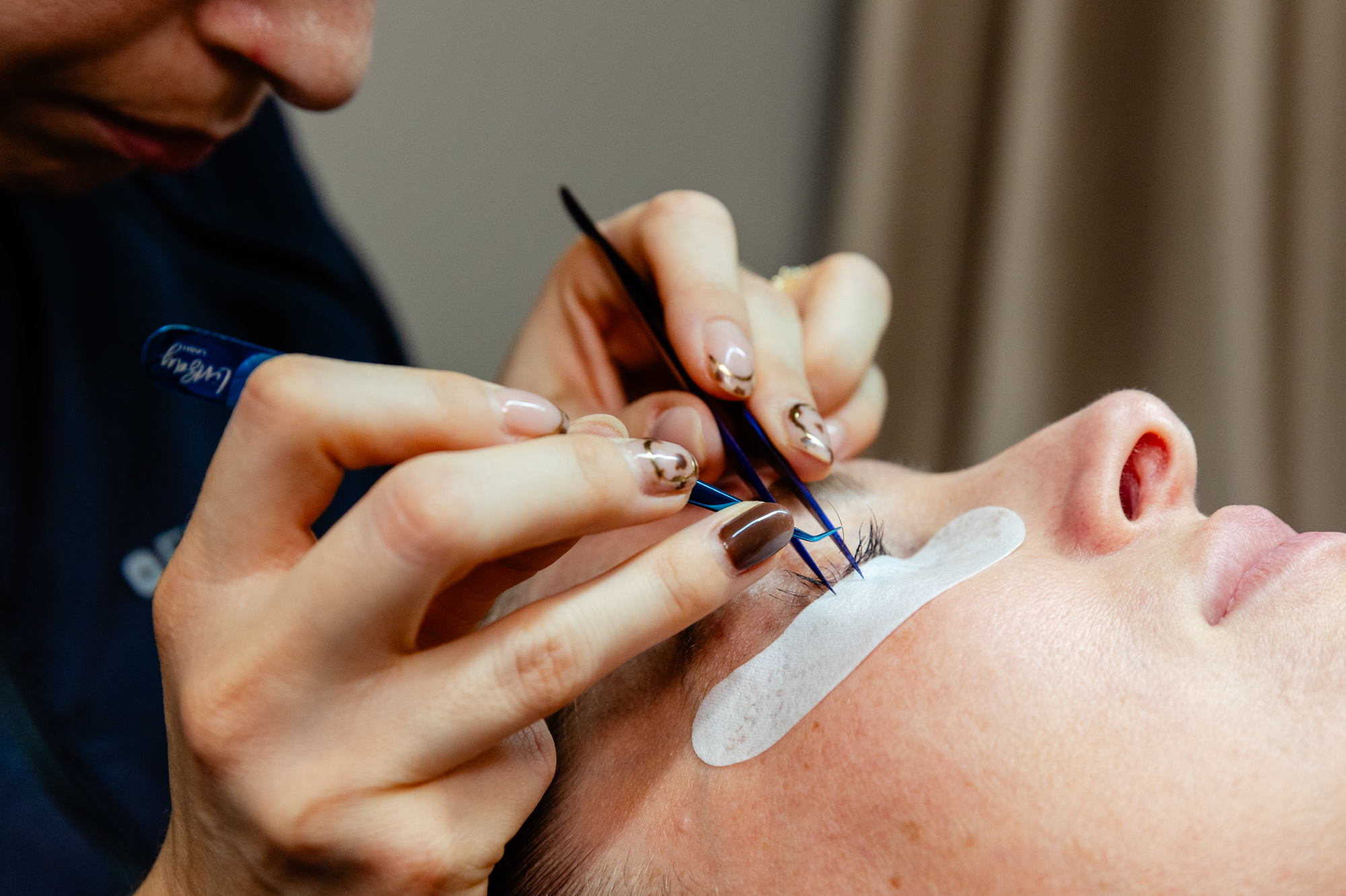 side angle of nurse applying last extensions