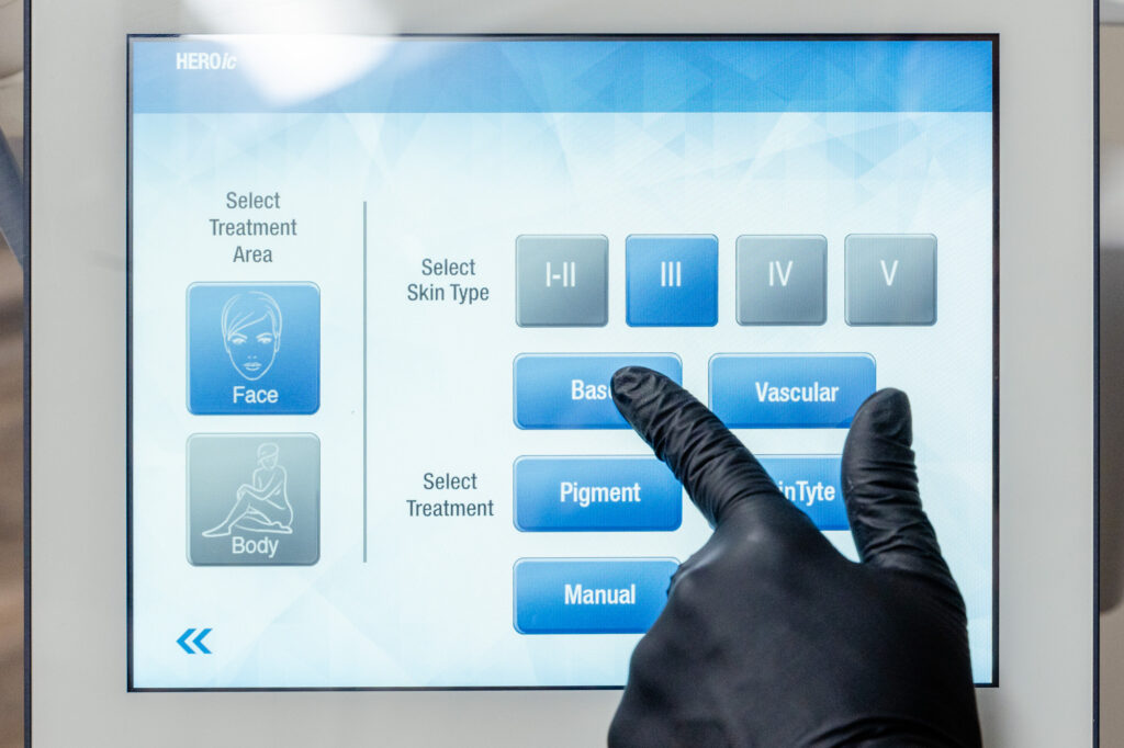 Close up of person selecting skin type of the moxi laser screen