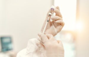 A close-up on the injection process for hormone replacement therapy near Mountain Lakes, NJ
