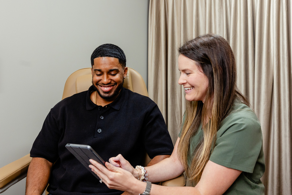 A patient and a provider smile about our weight loss program near Madison, NJ.